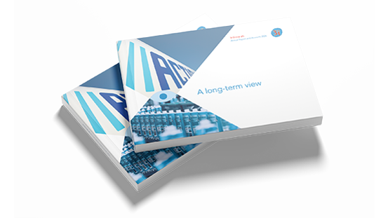 Stack of annual reports, with a cover showing 'A long-term view'